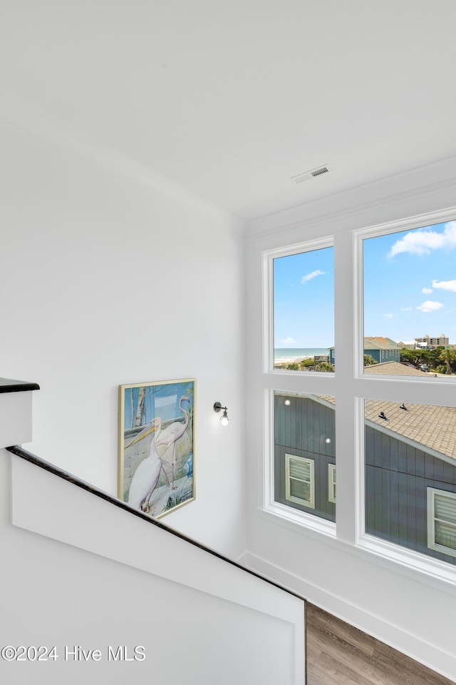 room details featuring visible vents and wood finished floors