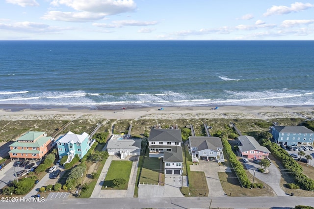 drone / aerial view featuring a residential view and a water view