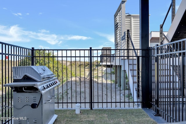 view of gate featuring fence