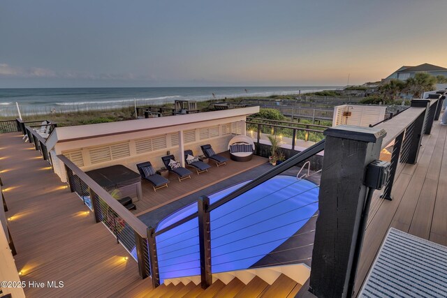 view of swimming pool featuring a water view