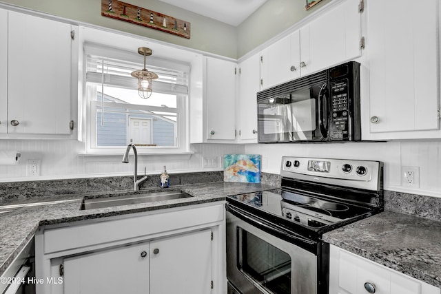 kitchen featuring sink, stainless steel range with electric cooktop, dark stone counters, and white cabinets