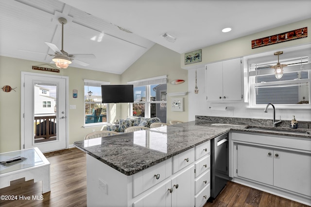 kitchen featuring sink, white cabinetry, dark hardwood / wood-style flooring, kitchen peninsula, and dishwasher