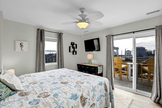 bedroom featuring access to exterior, ceiling fan, and light hardwood / wood-style floors