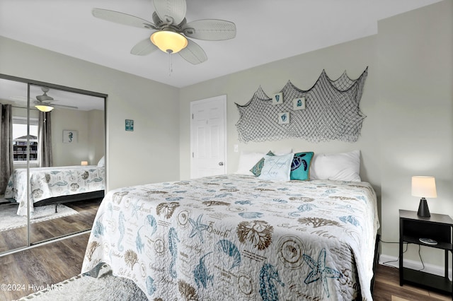 bedroom with dark hardwood / wood-style flooring, ceiling fan, and a closet