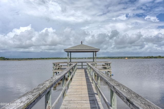 dock area with a gazebo and a water view