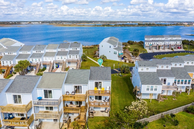 birds eye view of property with a water view