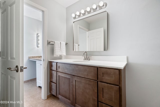 bathroom featuring vanity and tile patterned flooring