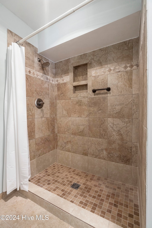 bathroom with a shower with curtain