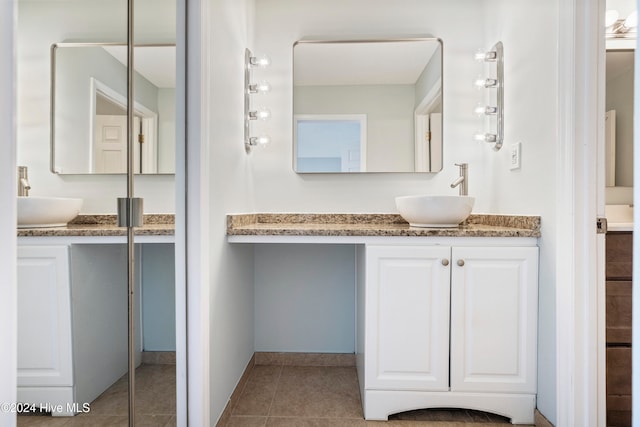 bathroom with vanity and tile patterned floors