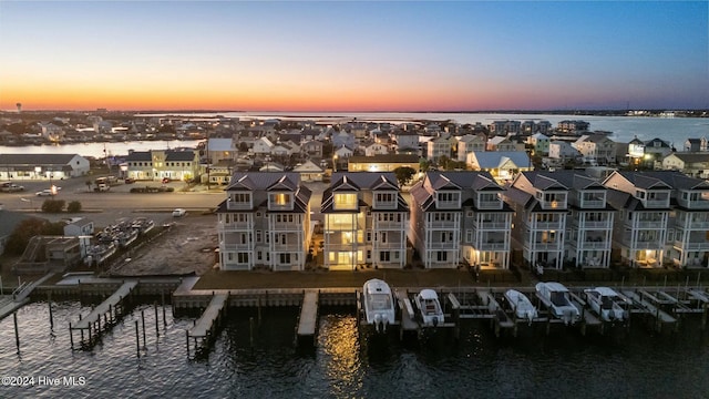 aerial view at dusk with a water view