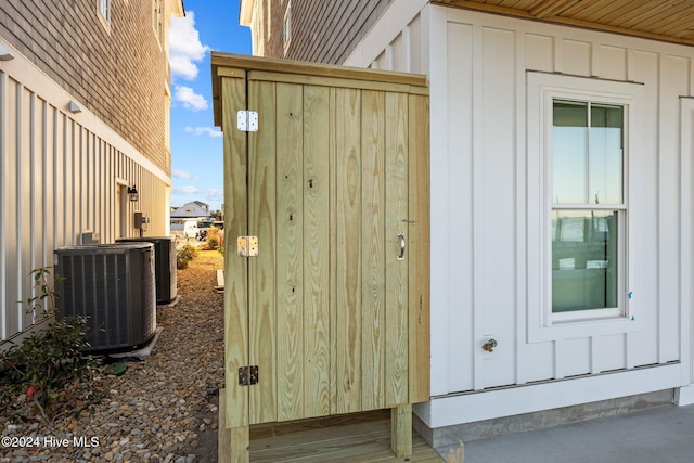 view of side of home with cooling unit