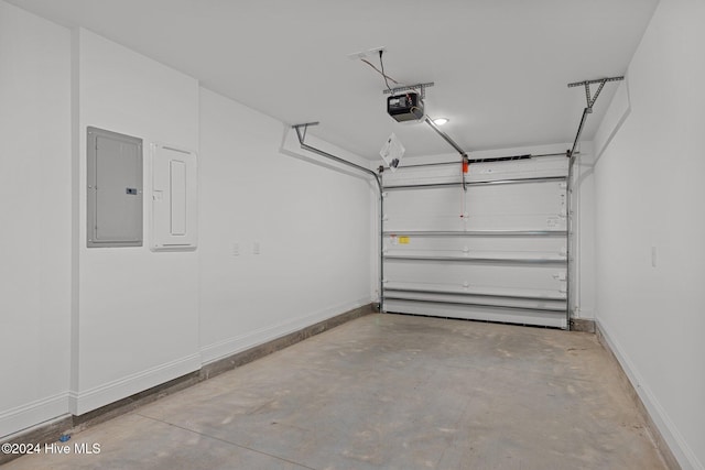 garage with a garage door opener and electric panel