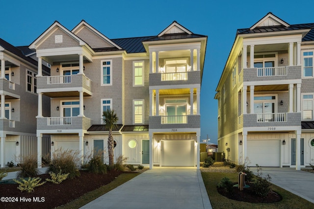 view of front of property with a garage and cooling unit