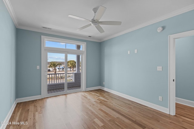 spare room featuring ceiling fan, light hardwood / wood-style floors, and ornamental molding