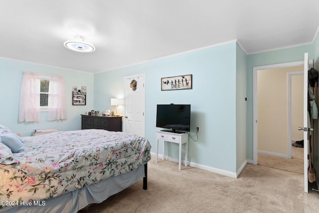 bedroom with light colored carpet and ornamental molding