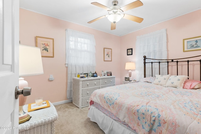 bedroom featuring ceiling fan and light colored carpet