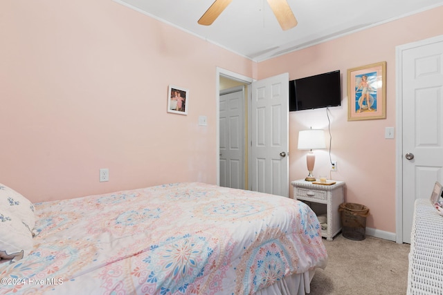 bedroom featuring ceiling fan and light colored carpet