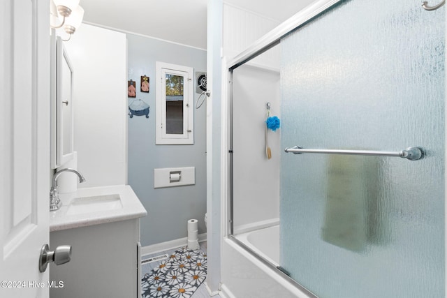 bathroom featuring tile patterned floors, vanity, and shower / bath combination with glass door