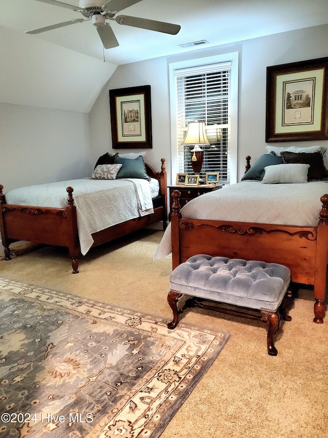 carpeted bedroom with lofted ceiling and ceiling fan