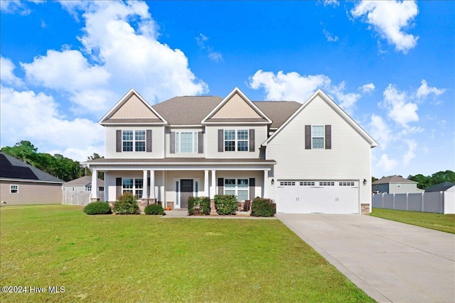 craftsman-style home with a porch, a garage, and a front lawn