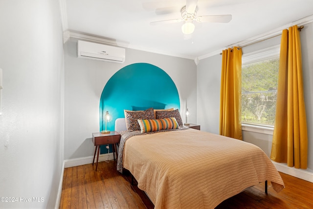 bedroom featuring hardwood / wood-style flooring, ceiling fan, crown molding, and a wall unit AC