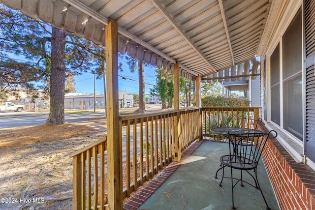 exterior space featuring vaulted ceiling