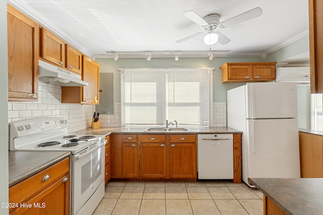 kitchen with sink, a wall mounted air conditioner, crown molding, white appliances, and light tile patterned flooring