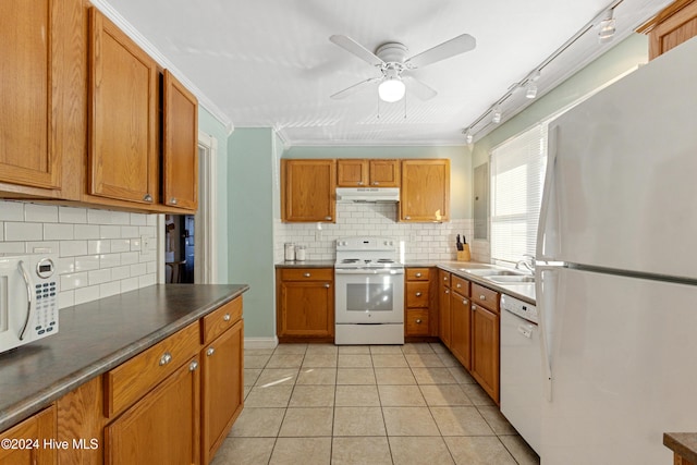 kitchen featuring decorative backsplash, light tile patterned flooring, white appliances, and ornamental molding