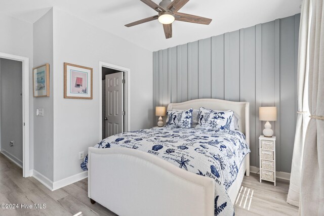 bedroom featuring ceiling fan and light hardwood / wood-style floors