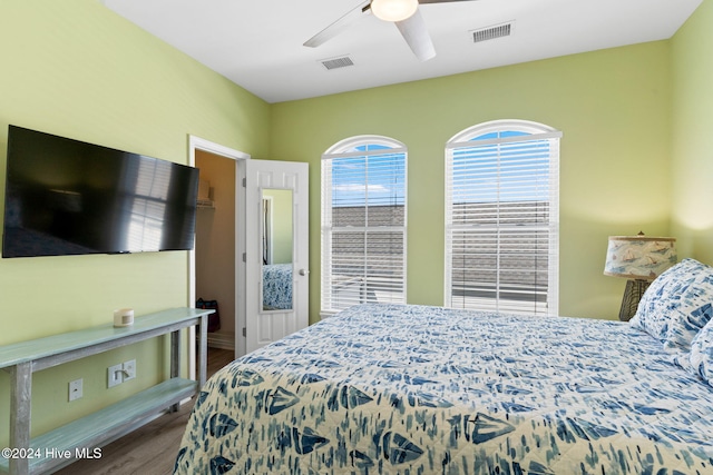 bedroom featuring ceiling fan and dark hardwood / wood-style flooring