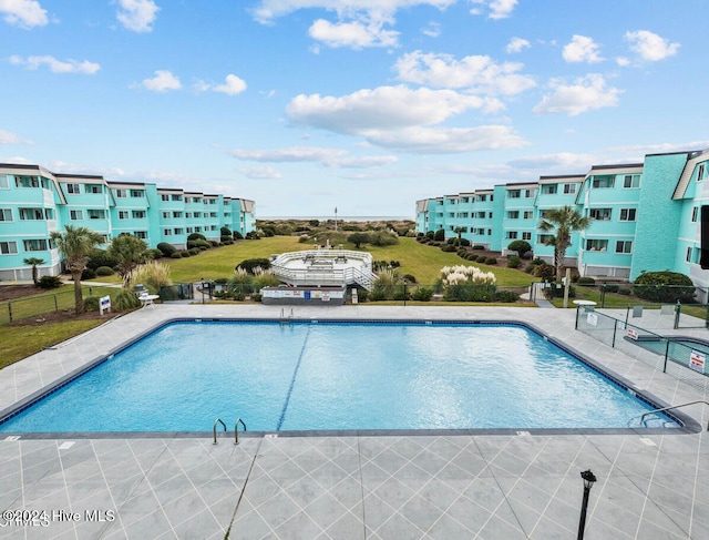 view of swimming pool with a patio area