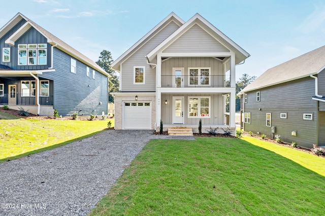 view of front of property with a front lawn, covered porch, a garage, and a balcony