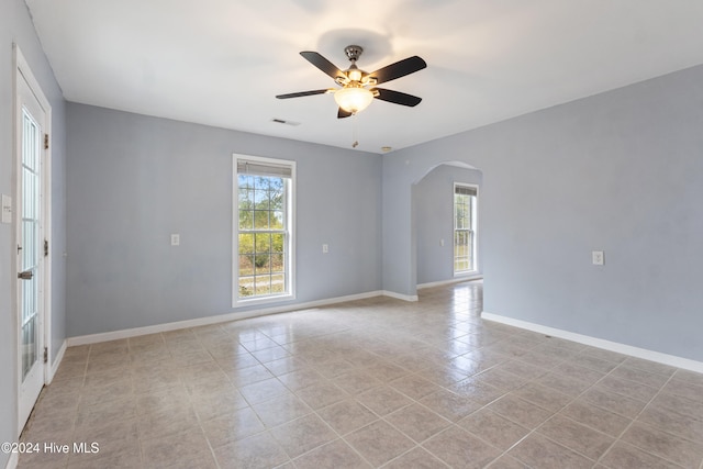 spare room with light tile patterned floors and ceiling fan