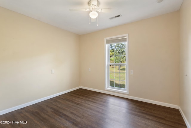 unfurnished room with ceiling fan and dark hardwood / wood-style floors