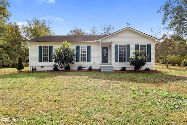 ranch-style house with a front lawn