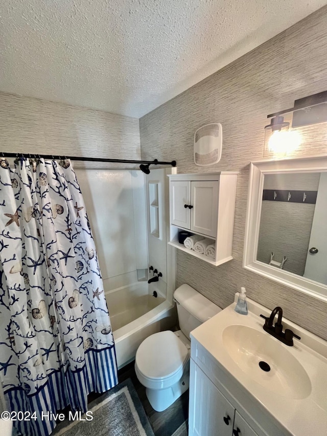 full bathroom with toilet, shower / bath combo with shower curtain, and vanity