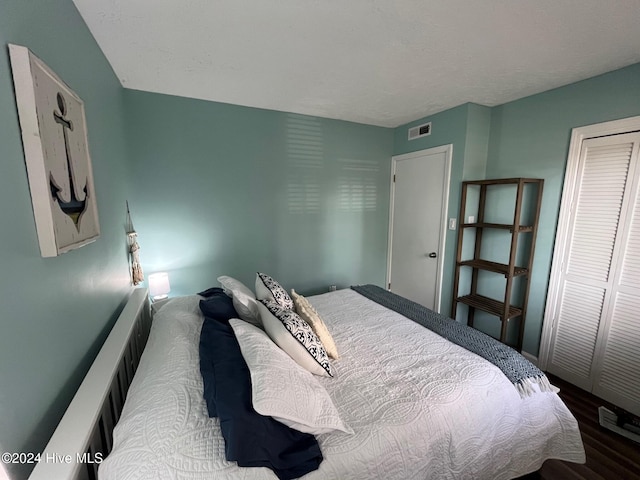 bedroom with a closet and wood-type flooring