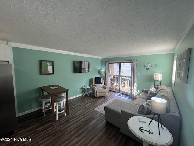 living room featuring a textured ceiling and dark wood-type flooring