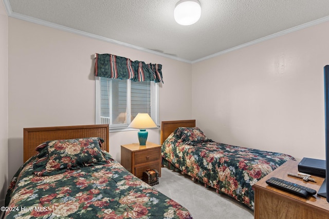 carpeted bedroom with a textured ceiling and ornamental molding