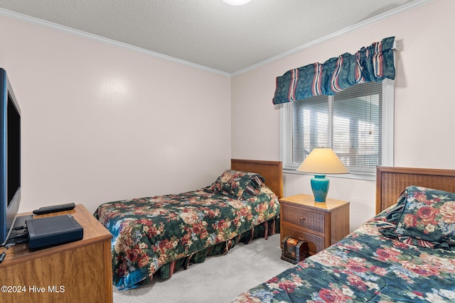 carpeted bedroom featuring a textured ceiling and ornamental molding