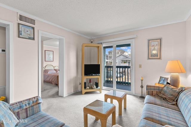 living room featuring light carpet, a textured ceiling, and crown molding