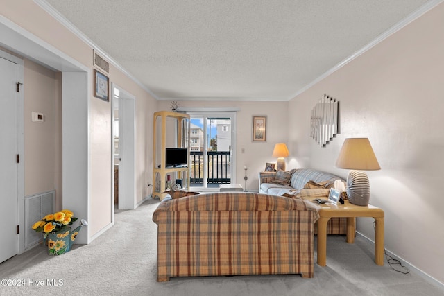 carpeted living room with a textured ceiling and ornamental molding