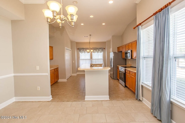 kitchen featuring a chandelier, stainless steel appliances, decorative light fixtures, and light tile patterned flooring