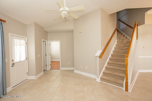 tiled entryway with vaulted ceiling and ceiling fan