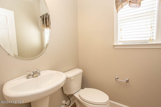 bathroom featuring toilet and sink