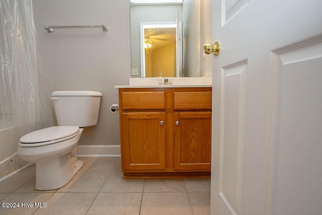 bathroom with vanity, toilet, tile patterned floors, and a shower with shower curtain