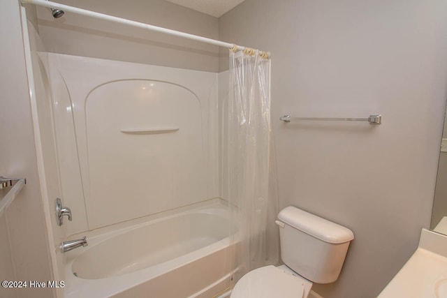 full bathroom featuring vanity, shower / tub combo, and toilet