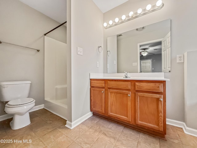 bathroom featuring vanity, ceiling fan, toilet, and a shower