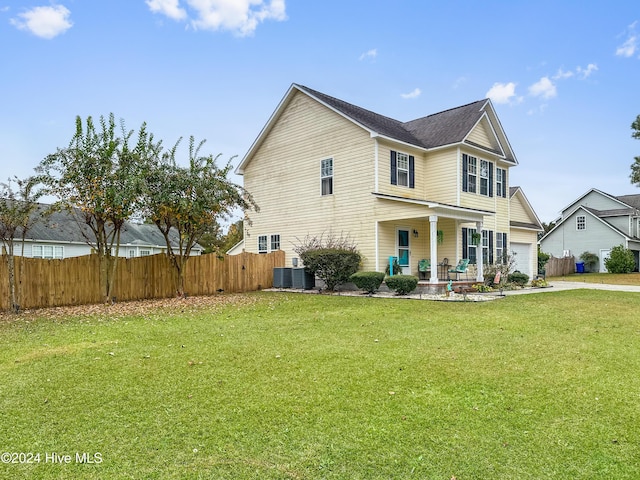 view of front of home featuring a porch, central AC unit, and a front lawn