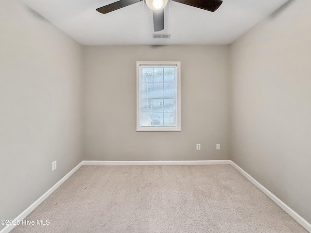 spare room featuring carpet flooring and ceiling fan